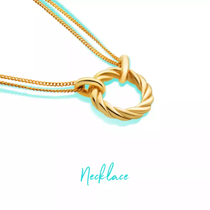 Gold necklace with a delicate chain and a twisted circular pendant, perfect for chic and modern styl
