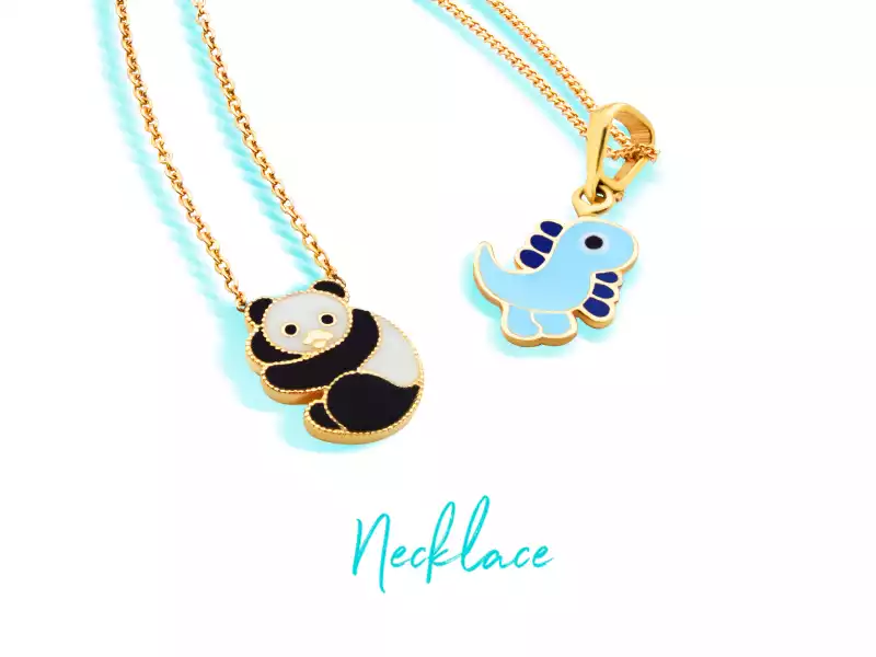 Two gold children's necklaces with panda and dinosaur pendants
